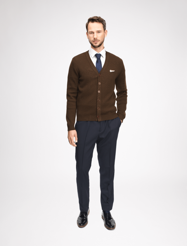 The sweater buttons up at the front